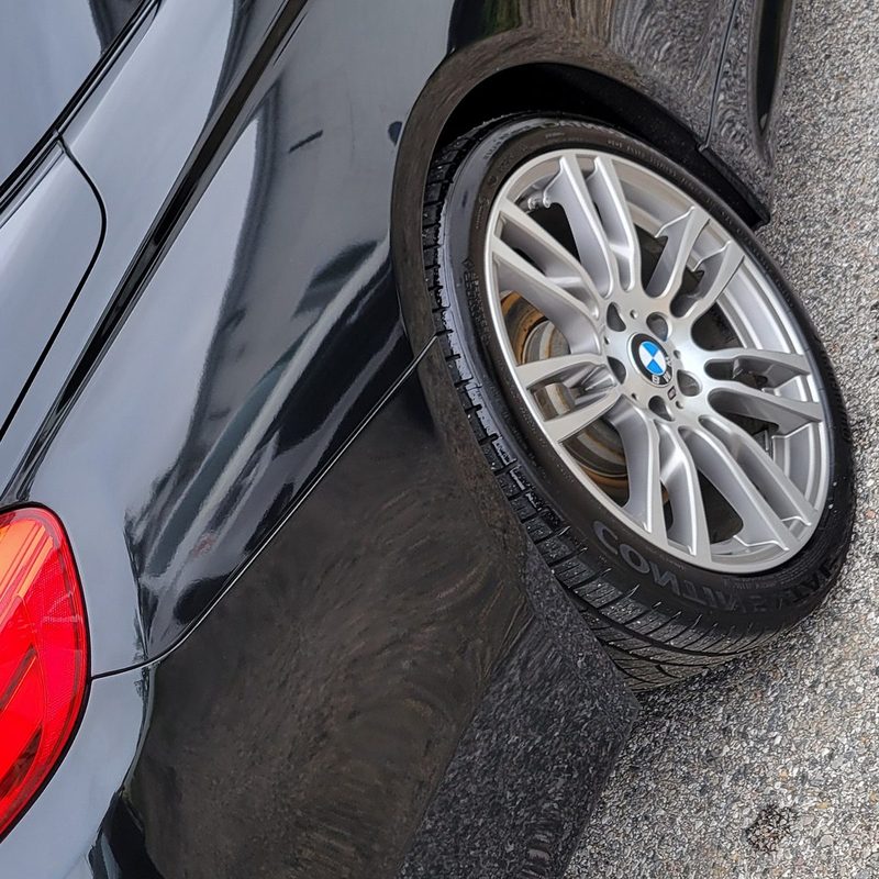 The same black fender with mirror gloss after machine polishing